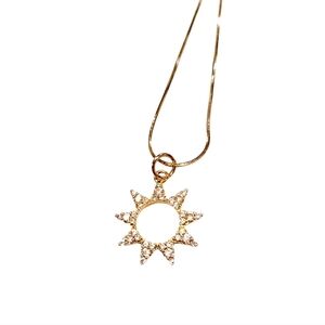 Sunburst zirconia pendant on an 18 inch gold plated copper snake chain; NWOT